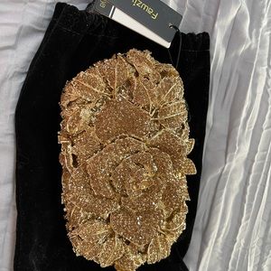New With Tags -  Gorgeous and elegant gold clutch handbag.